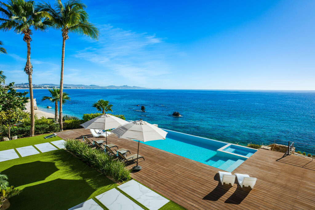 Cabo Golf La Caleta Casa Hendo is a stunning oceanfront estate perched above a swimmable cove, offering breathtaking Sea of Cortez for sale