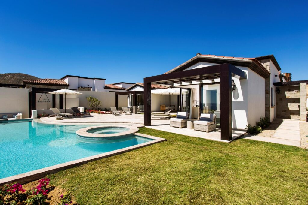 Cabo Golf La Caleta A once-in-a-generation legacy estate, never before on the market, this iconic beachfront residence offers incomparable prestige on the sands of Palmilla Bay, one of Cabo's most coveted and swimmable beaches. Set on a rare half-acre parcel directly on the water, the home features six bedrooms, six and a half baths, plus a full attached apartment, all executed in classic Palmilla style with timeless elegance and modern comfort. From the moment you enter, the architecture reveals its intention: a grand foyer flows effortlessly into an open living area and bar, framed by soaring ceilings and vast windows that disappear into the Baja breeze. The interiors dissolve into the outdoors, unveiling a dramatic terrace that cascades to a manicured lawn, infinity-edged pool, waterslide, spa, and expansive entertaining pavilion designed for unforgettable gatherings beneath the stars.The second level hosts two principal suites, each opening to a vast private terrace with sweeping for sale