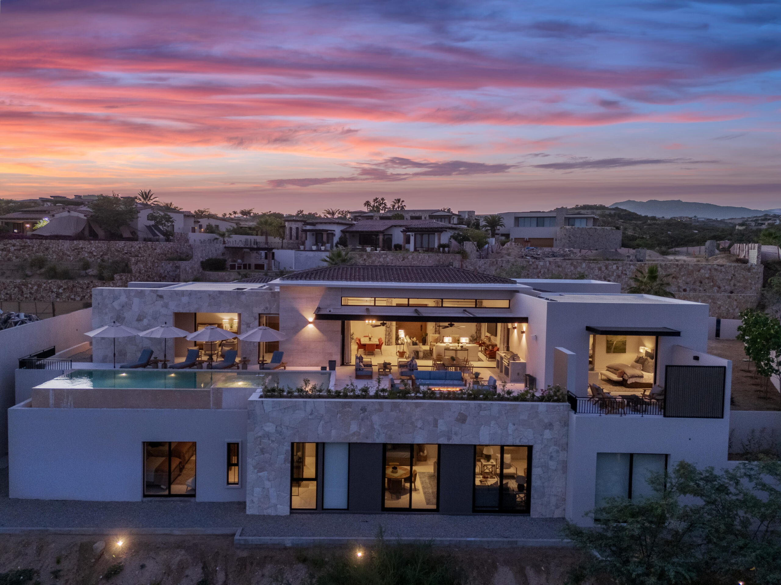 Cabo Golf Section 18- Horizontes Welcome to Horizontes 3, an exquisite custom-made home located within San José del Cabo's most sought-after community, Querencia. Surrounded by Tom Fazio's signature golf course, recognized as one of the best in the country, this stunning residence is just a short golf cart ride from the prestigious 5-star Club House. This remarkable 6-bedroom, 6.5-bathroom home elevates luxury living with a fresh vision of architecture and design. The layout features a cozy family room, an expansive bunk bed bedroom on the lower level, and a spacious maid's quarters with an independent entrance, making it ideal for entertaining family and friends.The property boasts outdoor living spaces, including tranquil green areas, an outdoor kitchen, an infinity pool, a jacuzzi, and ocean and ravine for sale