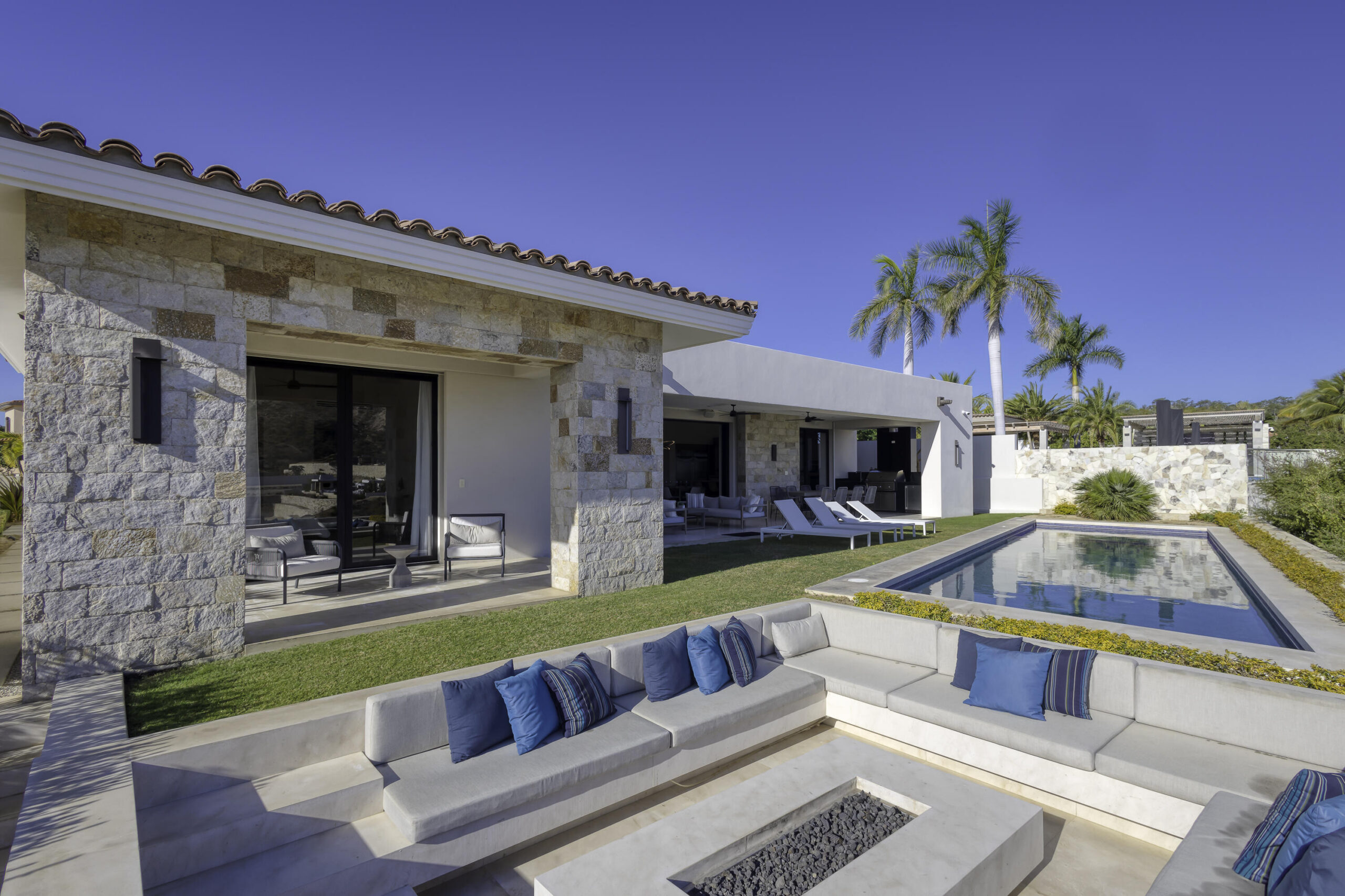 Cabo Golf Golf Villas Set along the lush Bermuda fairways of the Tiger Woods-designed Oasis Short Course, this exceptional five-bedroom hacienda-style residence blends classic Mexican architecture with refined contemporary luxury. A grand central courtyard opens to an expansive great room that flows seamlessly to a private terrace with heated pool, palapa swim-up bar, and fire-pit lounge overlooking the Oasis par-three course. Designed for effortless entertaining, the home features multiple indoor and outdoor living spaces, a gourmet kitchen, and a covered outdoor grill ideal for hosting family and friends. As a Legacy Club home at Diamante Cabo San Lucas, ownership provides access to championship golf, the iconic Crystal Lagoon®, spa, beach club dining, and miles of Pacific coastline. for sale